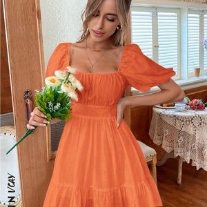 Bright orange tie back dress